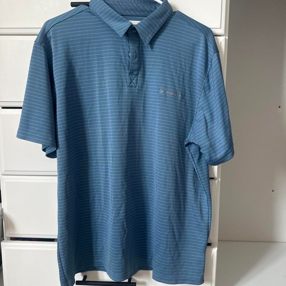 Columbia blue polo shirt with thin white vertical stripes